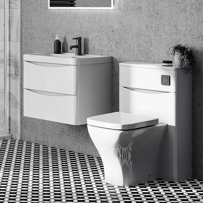 White bathroom furniture with black and white floor tiles