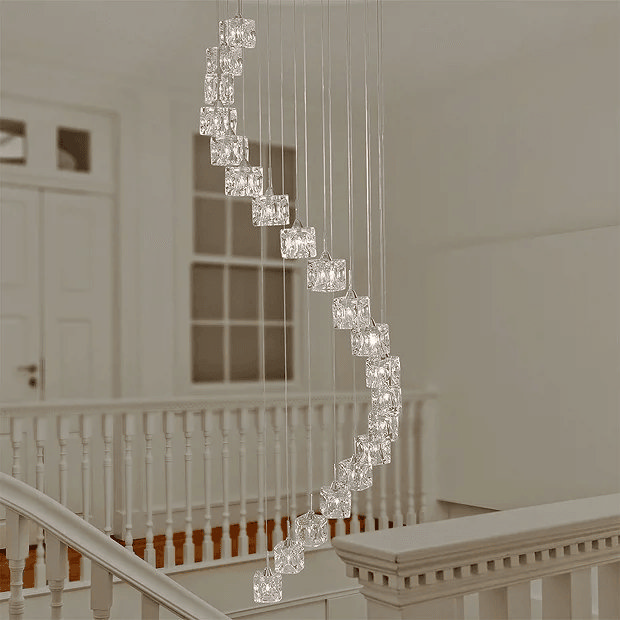 Spiral glass chandelier over staircase