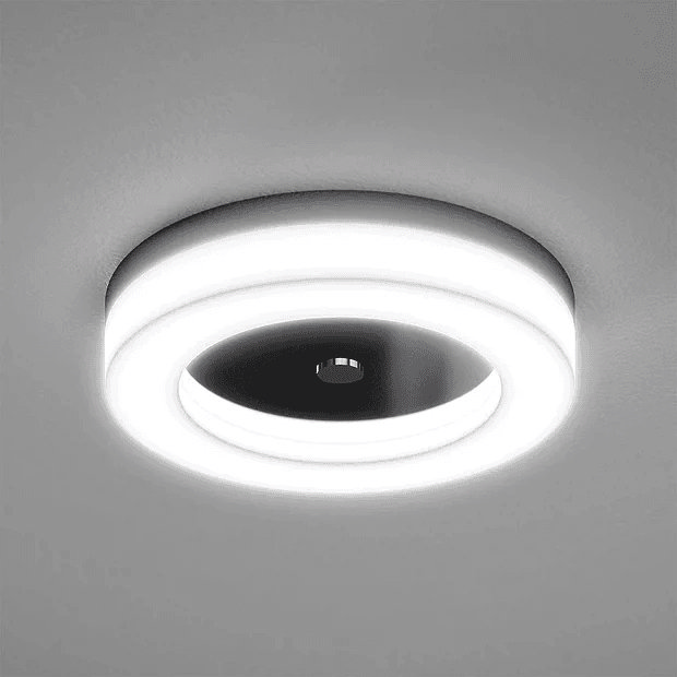 Round LED light on grey ceiling