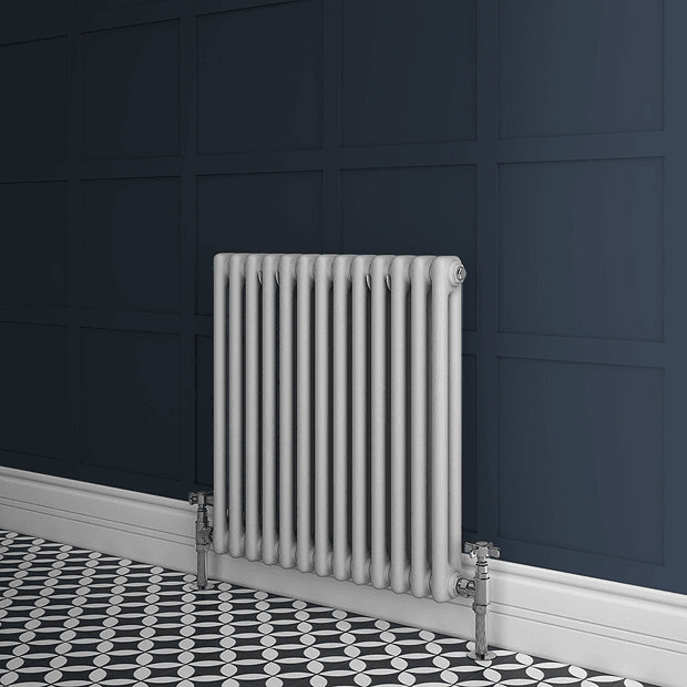 White radiator on navy blue wall