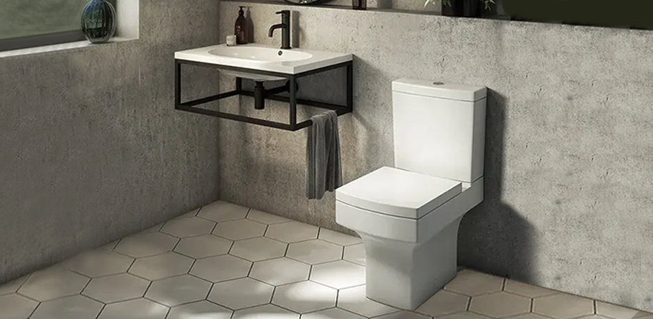 Short projection toilet and black wall mount basin in grey room