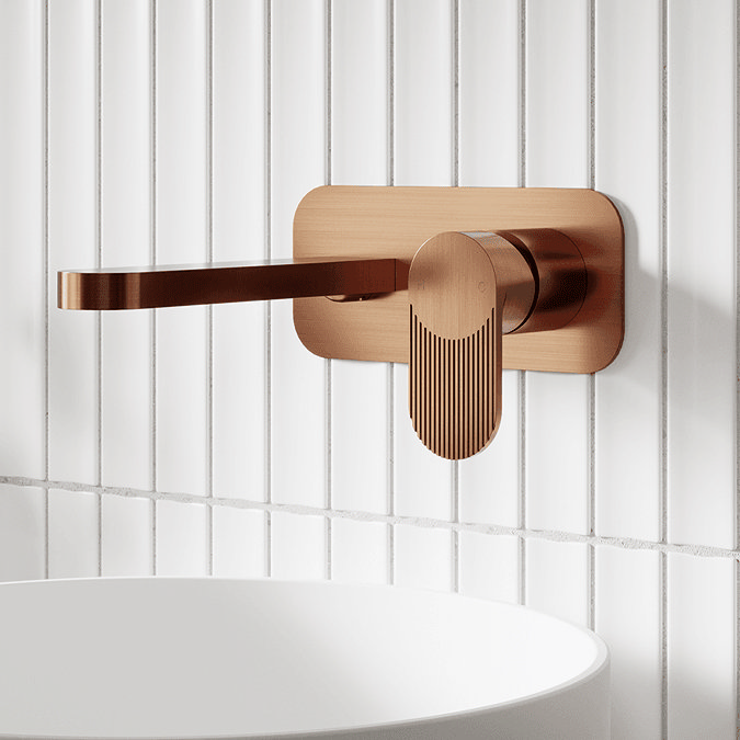 Bronze tap on white tiles