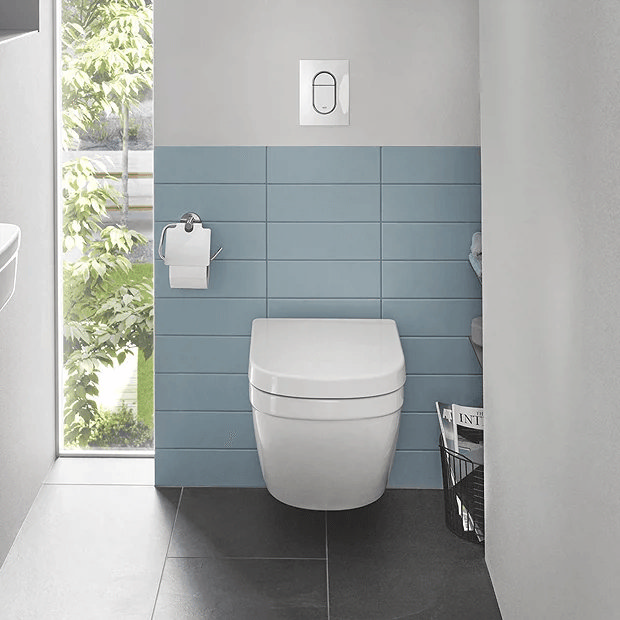 Wall hung toilet in small bathroom with blue tiles