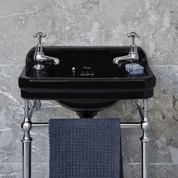 Black and chrome traditional washstand against grey wall