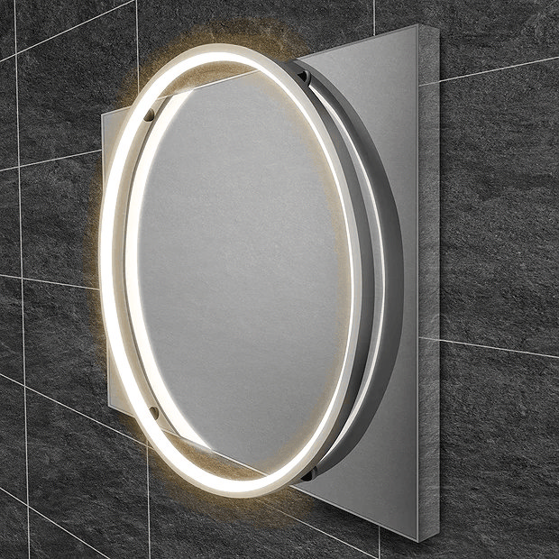 Square mirror with round light on dark grey tiles
