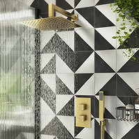 Brass Shower on Black and White Tiles
