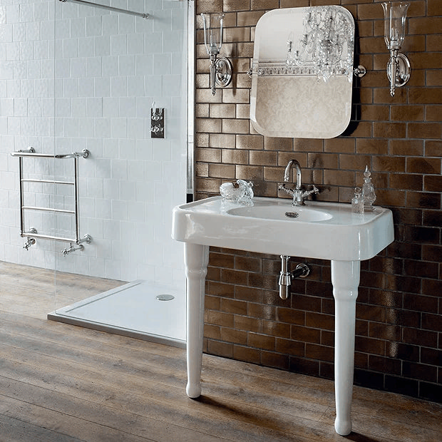 White traditional washstand against brown tiles