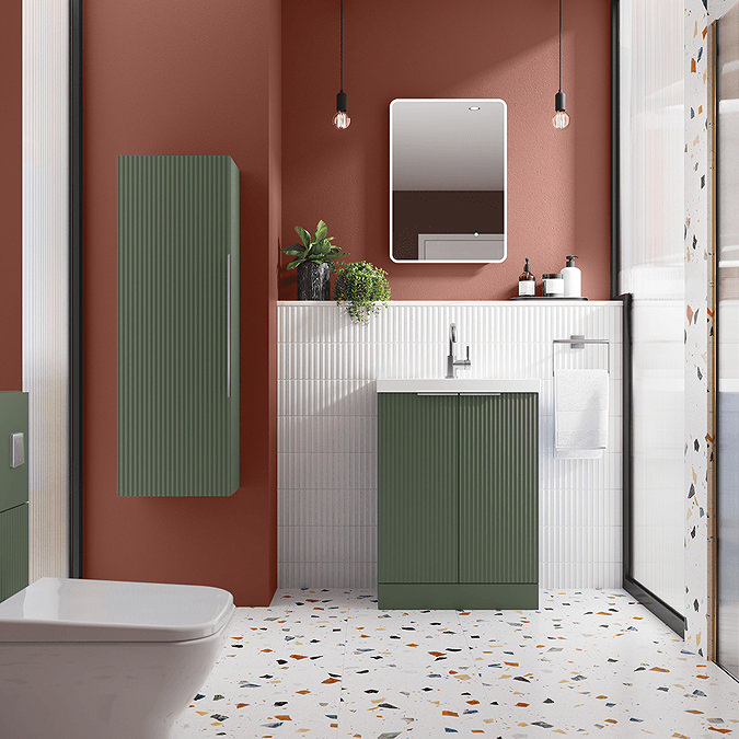 Green bathroom furniture with orange walls