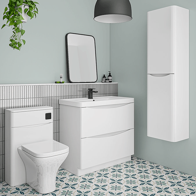 White bathroom furniture with mint green walls