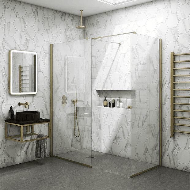 Marble bathroom with brushed brass shower and large shower niches