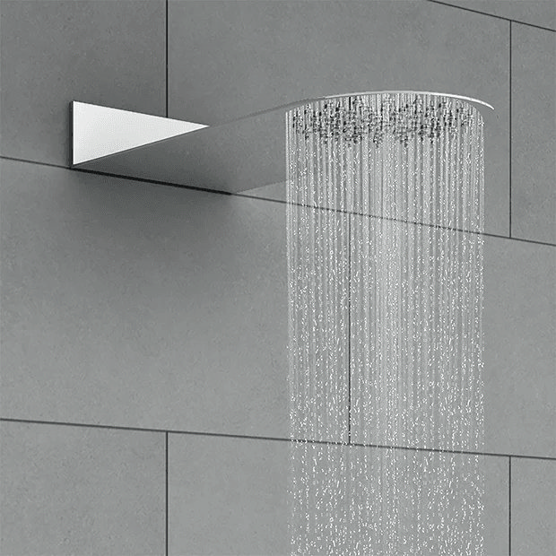 Modern round shower head on grey tiles