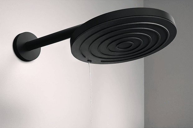 Black modern shower head in light grey room