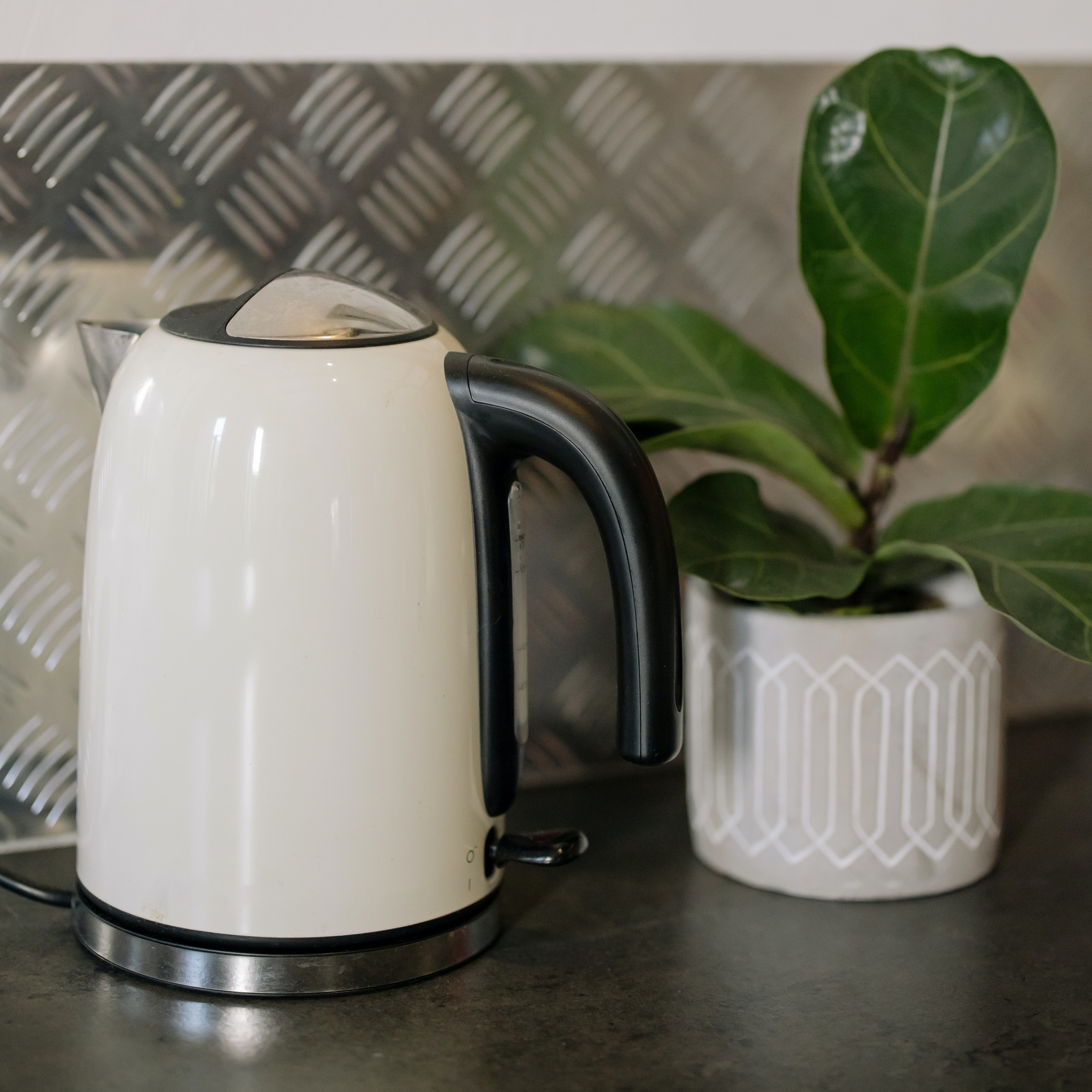 White kettle on grey counter