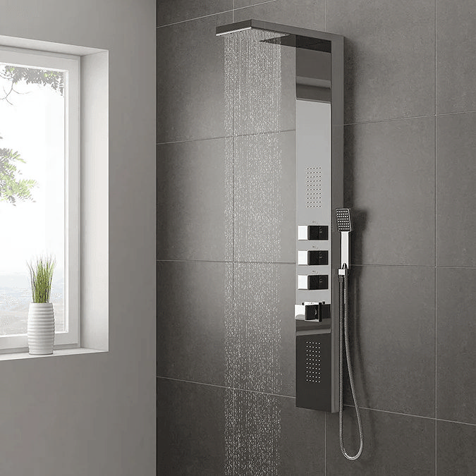 Chrome shower tower on grey tiles