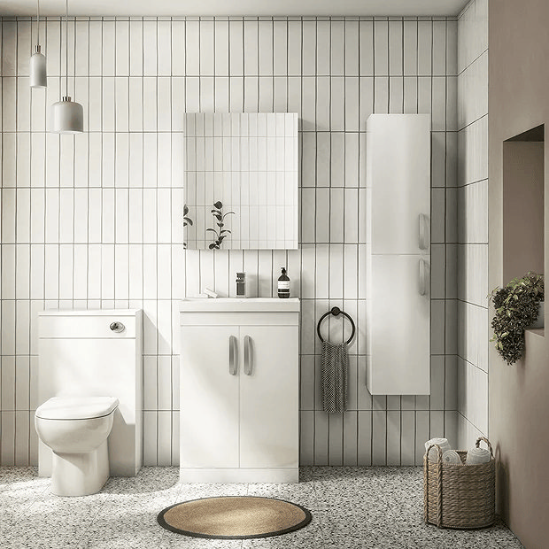 White bathroom suite with white metro tiles