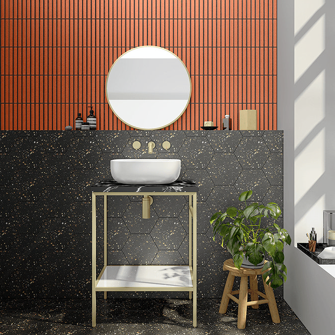 Black bathroom with orange tiles