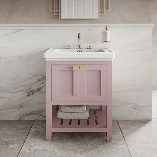 Pink vanity unit with brass handles and marble tiles