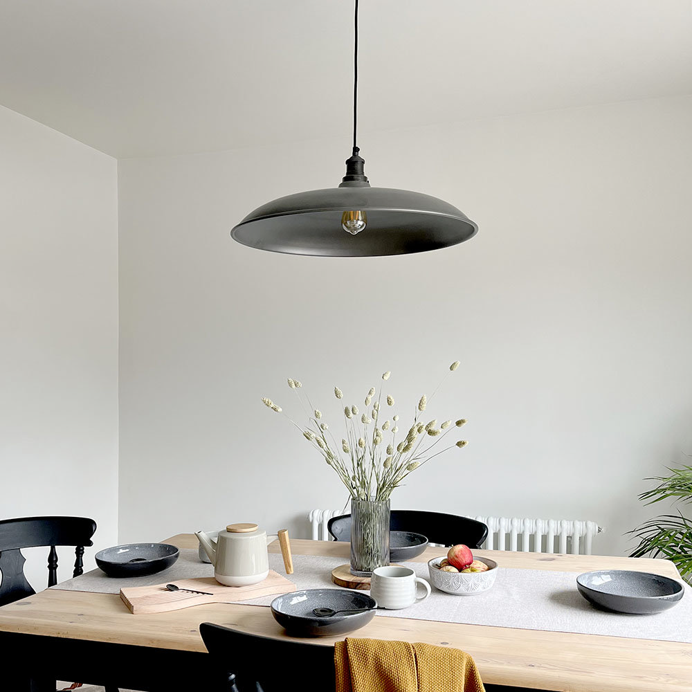 Kitchen with black open pendent light