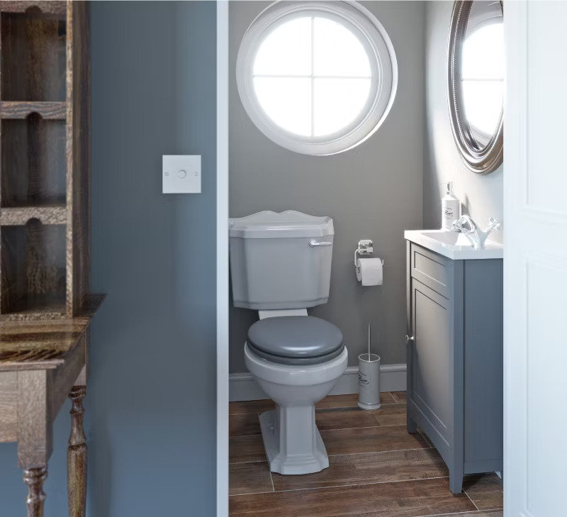 grey cloakroom with circular window