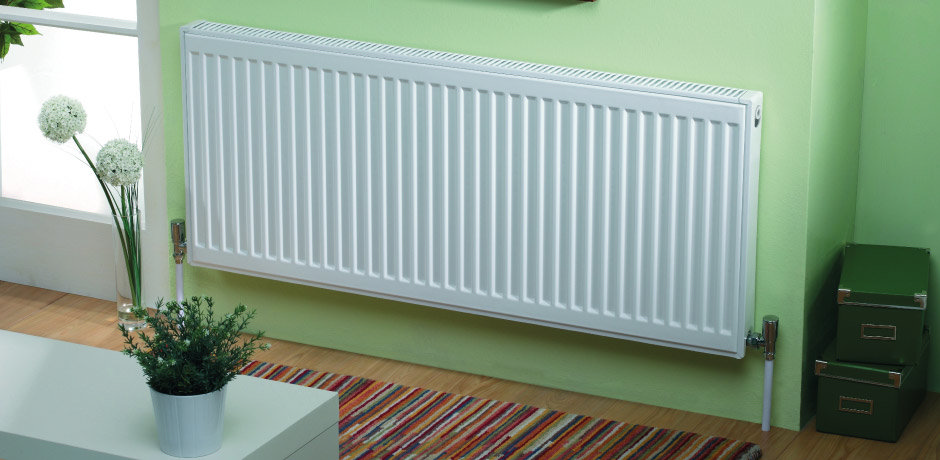White Convector Radiator against lime green wall