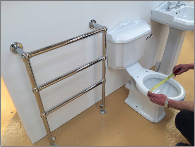 man measuring a toilet bowl