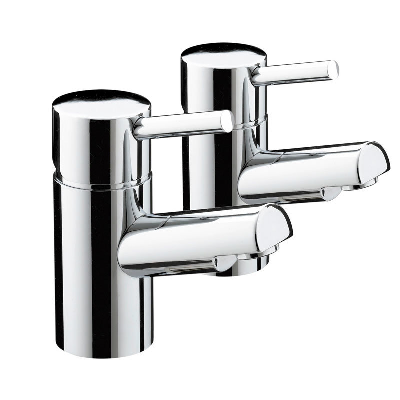 two shiny chrome basin taps