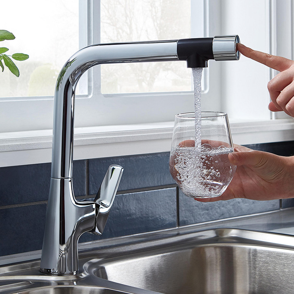 sink mixer tap filling glass with water