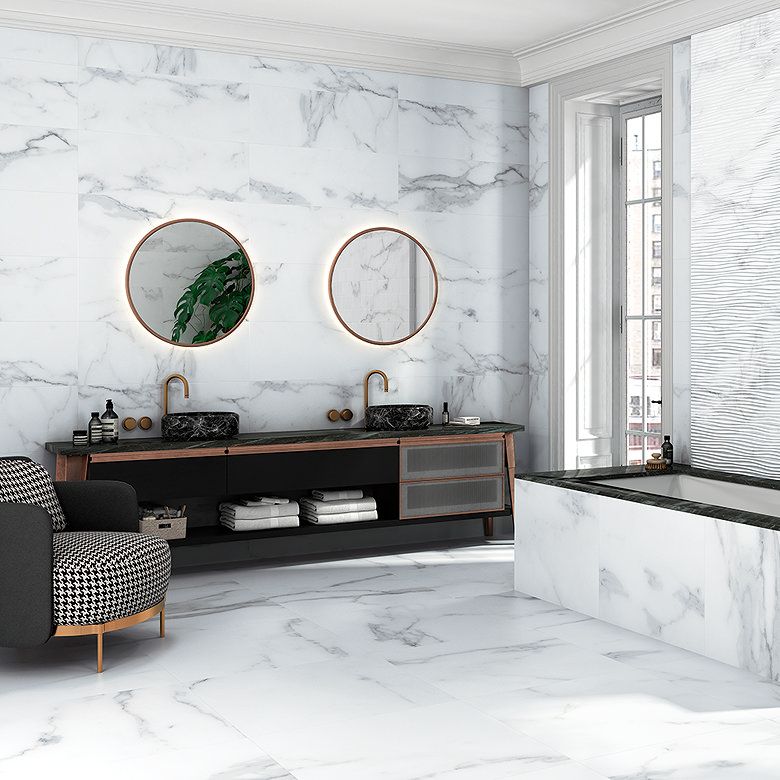 Spa-like bathroom with marble-effect tiles, double vanity, illuminated mirrors and a built-in bath