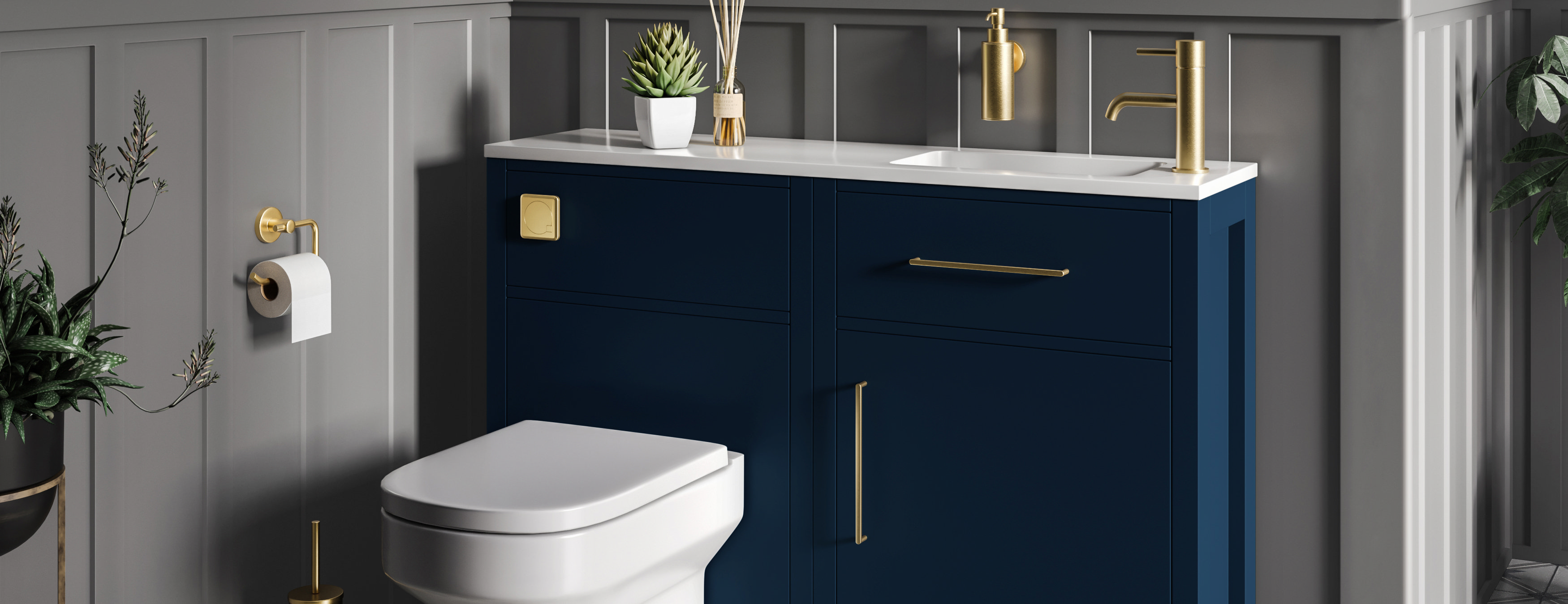 Elegant navy blue bathroom furniture set with brass accents, featuring a modern back-to-wall toilet, sleek basin unit, and luxurious grey panelled walls for a timeless aesthetic.