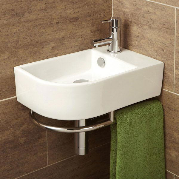 HiB Temoli Washbasin with Towel Rail - 8976 - Close up image of a modern corner cloakroom basin with towel rails against a brown tiles wall.