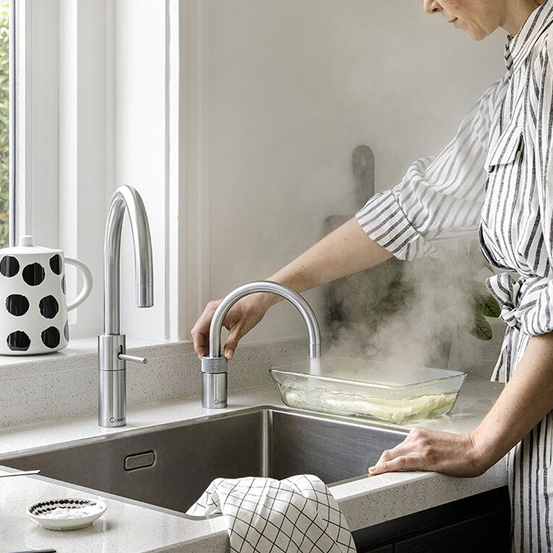 two steel quooker nordic taps, light kitchen