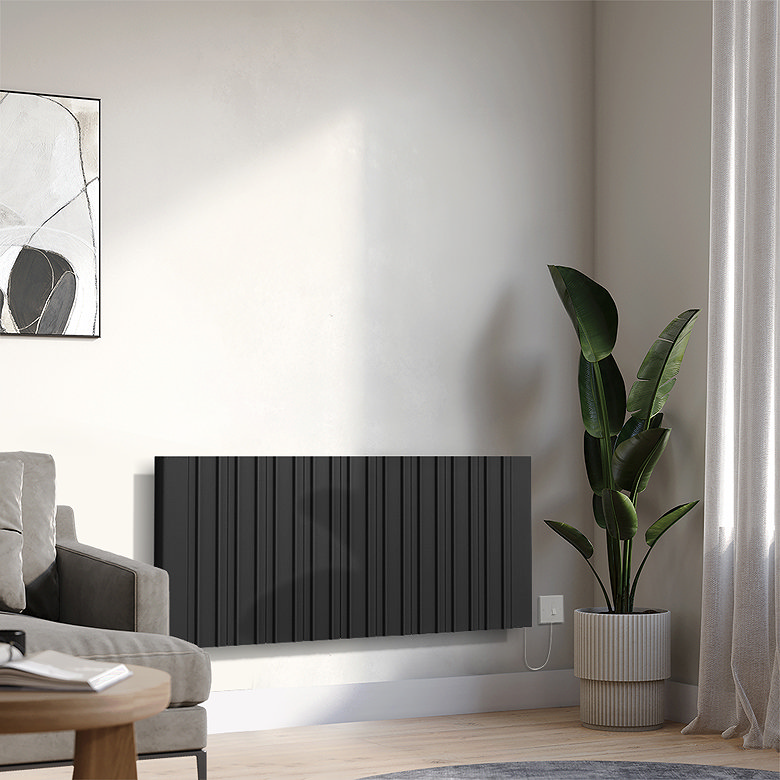 Modern black electric horizontal radiator mounted on a living room wall beside a houseplant