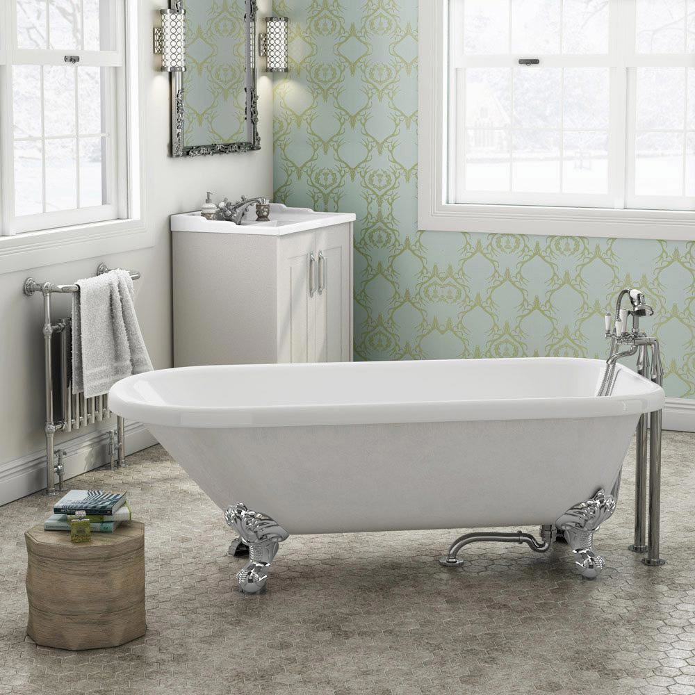 Bathroom Featuring Patterend Wallpaper and Roll Rop Bath