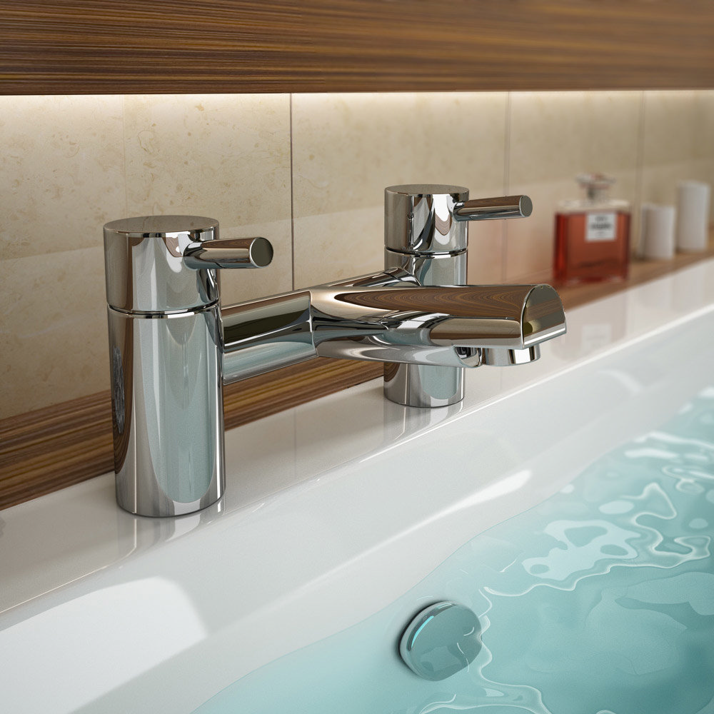 Cruze Modern Bath Taps - Chrome
- CRU003 - Close up image of chrome bath taps next to wood and tile wall