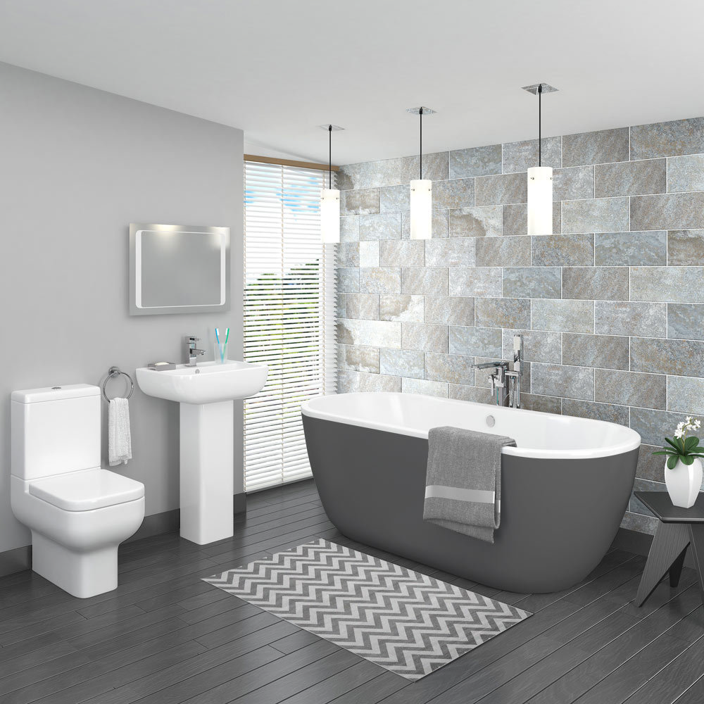 The Pro 600 modern grey bathroom suite includes a grey painted freestanding bath, full pedestal bathroom basin and a close-coupled toilet. Other features of this stunning grey bathroom design include light grey painted bathroom walls, light grey wall tiles and dark wood effect bathroom flooring.