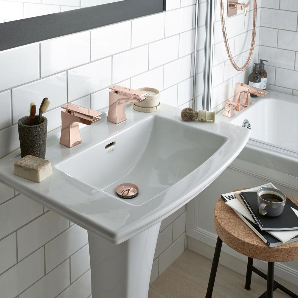 Copper bathroom taps and accessories offer a refreshing change from chrome. This small bathroom showcases the Hemsby collection of rose gold bathroom fixtures manufactured by trusted UK firm Heritage Bathrooms.