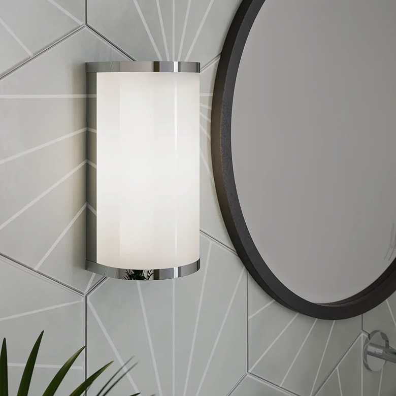 Chrome fluted wall light on grey tiled wall