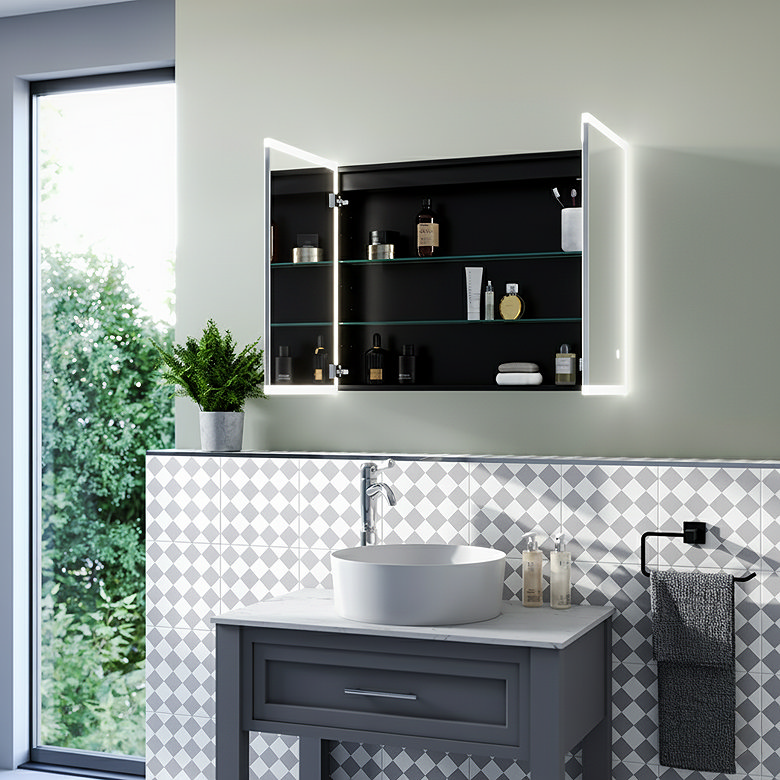 LED illuminated heated bathroom mirror cabinet with open doors and internal storage above vanity basin