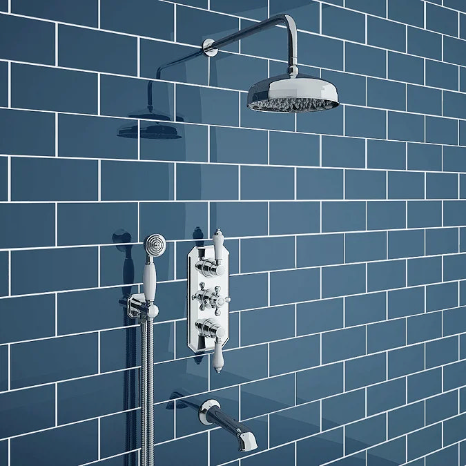 Traditional chrome shower set against blue metro tiles