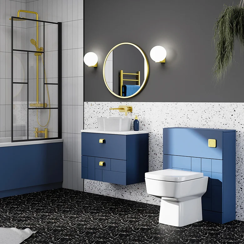 Modern bathroom with blue cabinetry, terrazzo wall tiles and black terrazzo flooring.