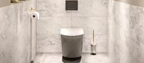 Modern bathroom featuring a wall-hung toilet with a concealed cistern. This sleek design hides the tank behind a false wall, offering a minimalist look while maximising floor space. Perfect for those looking to create a clean and contemporary bathroom layout.