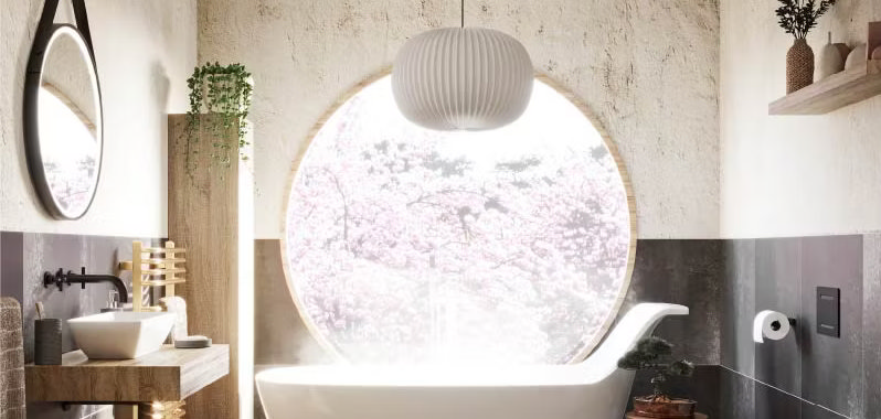 Japandi bathroom design featuring a large circular window framing a serene cherry blossom view. Blending Japanese minimalism with Scandinavian elegance, this space showcases a freestanding bathtub, natural wood vanity, and soft neutral tones for a tranquil, spa-like atmosphere.