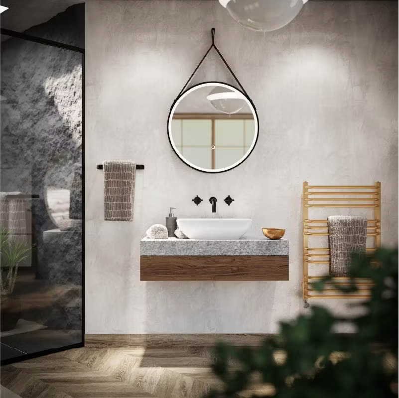 Japandi-inspired bathroom with a floating wooden vanity and stone basin, paired with a round mirror hanging on leather straps. The natural tones, minimalist design, and bamboo towel rail create a calm, Zen-like ambiance.