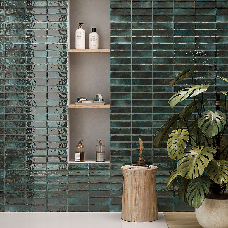 Glossy green zellige-style tiles with bathroom niche.