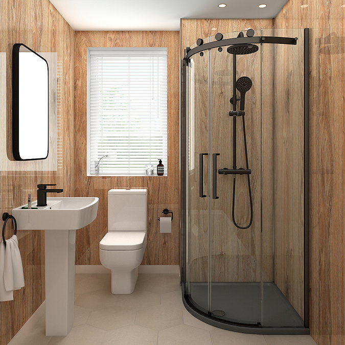 Modern compact bathroom featuring a black-framed corner shower enclosure, natural wood-effect walls, a pedestal basin with black mixer tap, and a sleek backlit mirror.