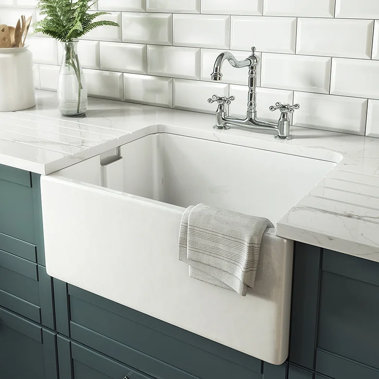 White Belfast ceramic sink with chrome bridge tap