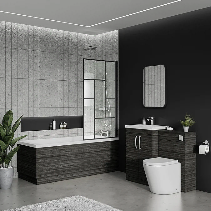 Modern bathroom with dark wood furniture, built-in bathtub with glass shower screen, wall-mounted mirror, and stylish grey tile and black accent walls