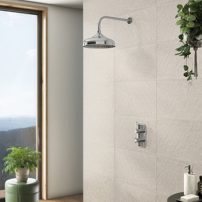 Minimal walk-in shower with rainfall shower head, stone-effect tiles and natural greenery