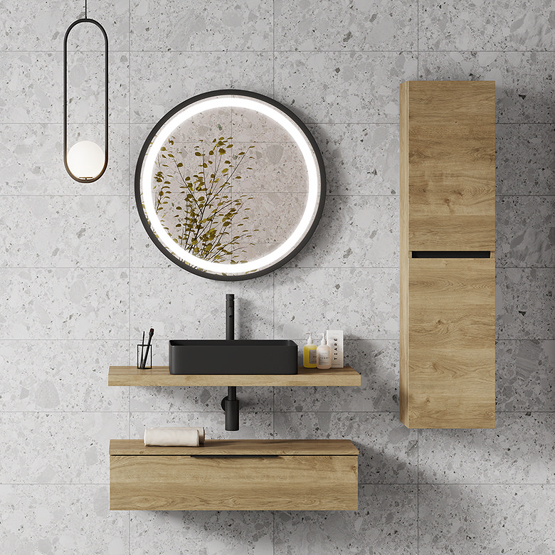 Light grey terrazzo-effect bathroom tiles with oak vanity and round LED mirror.