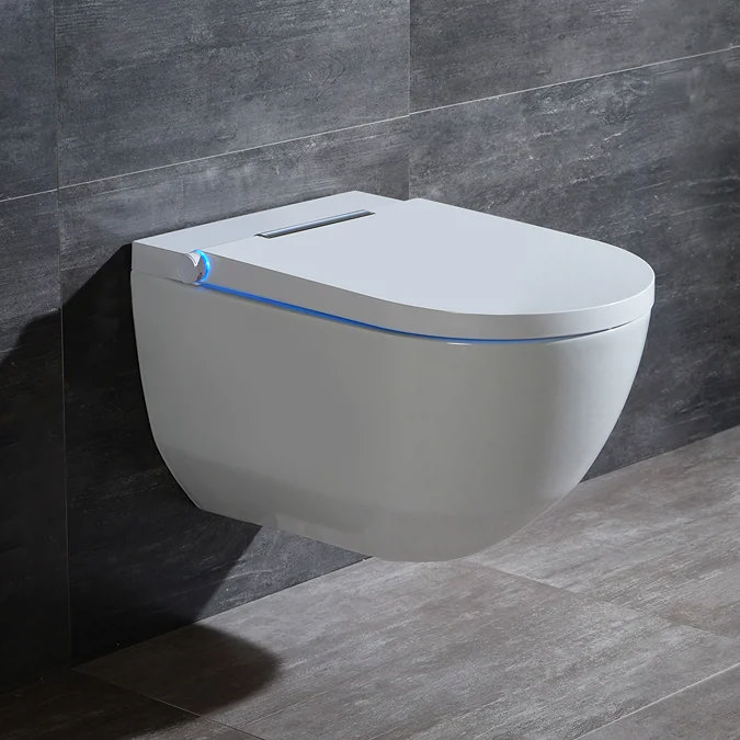 Modern wall-mounted smart toilet with sleek design, featuring a subtle blue LED night light, set against dark grey textured tiles in a contemporary bathroom.